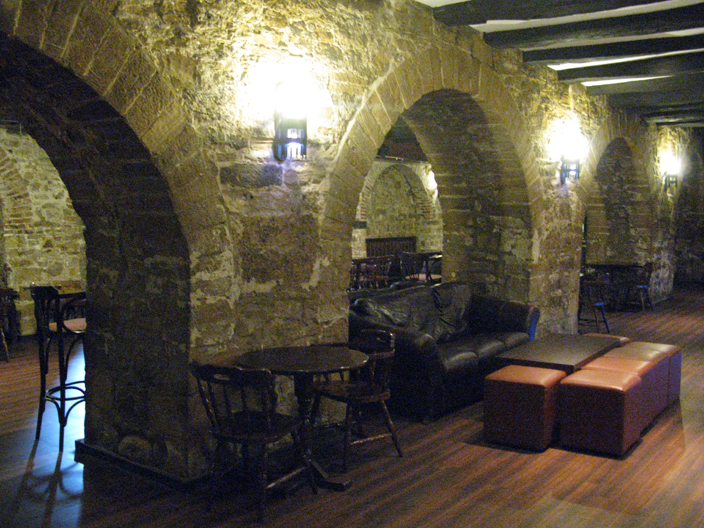 The eleventh century Norman undercroft, today the bar of University College, at one of its few quiet moments. 
